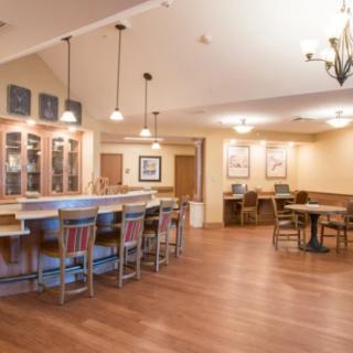 Cozy restaurant interior with a bar and seating area.