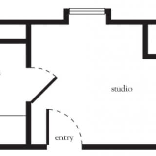A simple floor plan of a studio apartment showing an entryway and main living area.