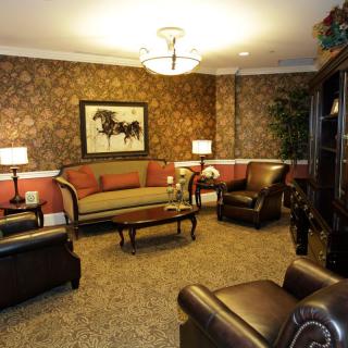 A cozy living room with elegant furniture and warm lighting.