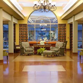 A beautifully designed lobby featuring comfortable seating, elegant decor, and ample natural light.