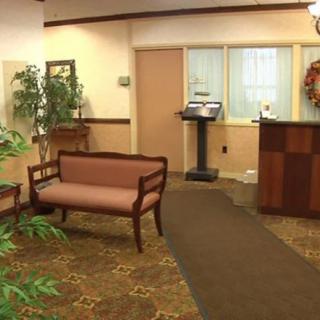 A welcoming lobby area with seating and a reception desk.