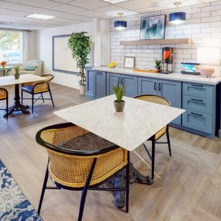 A modern dining area featuring stylish furniture and decor elements.
