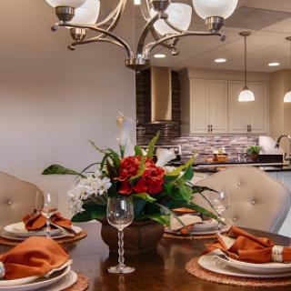 A beautifully arranged dining table with a floral centerpiece, perfect for an elegant meal.