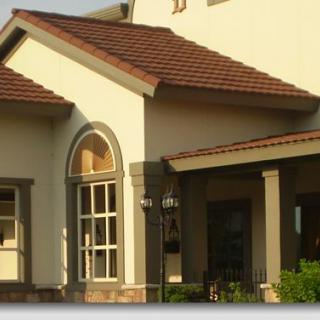 The exterior of a residential house showcasing classic architectural features.
