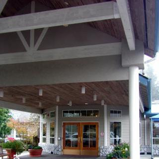 The welcoming entrance of a modern hotel showcasing elegant architectural design.