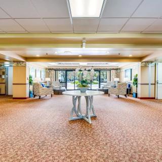 A spacious and modern lobby with comfortable seating and elegant decor.