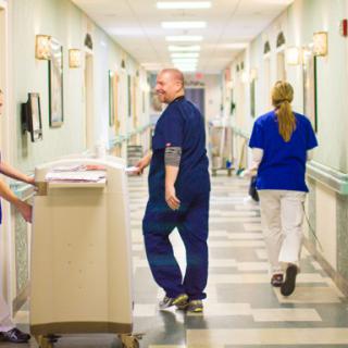Medical staff working in a hospital hallway.