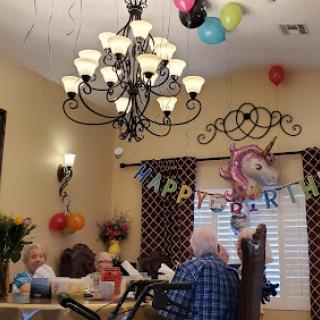 A joyful birthday celebration with colorful decorations and a warm atmosphere.