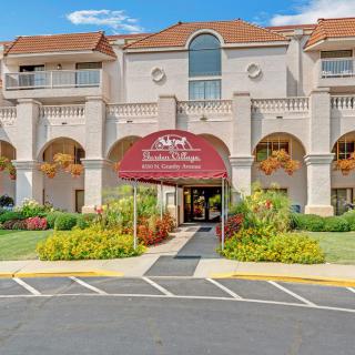 A hotel building with a welcoming entrance and well-maintained landscaping.