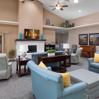 A modern and cozy living room featuring stylish furniture, a fireplace, and tasteful decor.