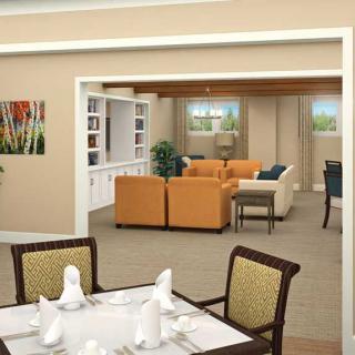 A modern open-concept living and dining area with stylish furniture and decor.