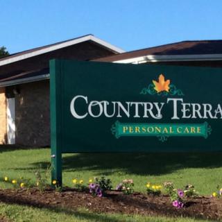 Sign for Country Terrace Personal Care in front of a building.