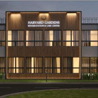 Exterior view of a rehabilitation and care center building at night.