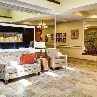 A cozy lobby area with comfortable seating and warm decor.
