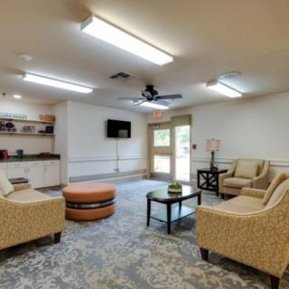 A cozy living room with comfortable seating and a television.