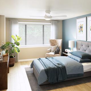 Modern bedroom with elegant decor, featuring a cozy bed and vibrant natural lighting.