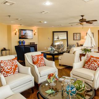 A cozy living room featuring comfortable seating and elegant decor.