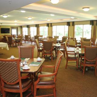 Spacious dining area with neatly arranged tables and chairs.