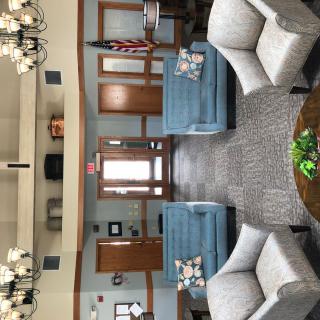 A spacious lobby with comfortable seating arrangements and tasteful decor.