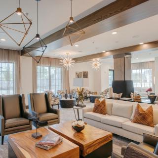 A modern living room with stylish furniture and elegant lighting.