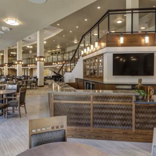 A modern restaurant interior featuring stylish seating and elegant decor.