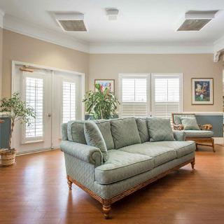 A cozy living room featuring a comfortable sofa and stylish decor.