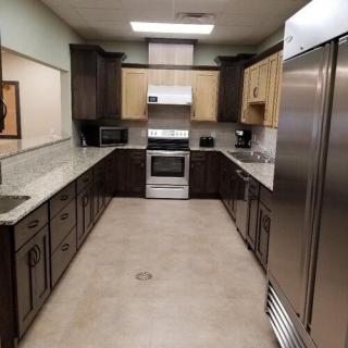 A modern kitchen with spacious countertops and stainless steel appliances.