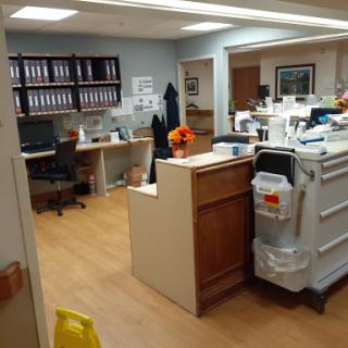 A view of an office space with desks, files, and organizational tools.