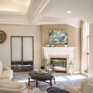 A beautifully designed living room featuring a cozy fireplace and elegant furniture.