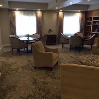 A cozy living room with comfortable seating and soft lighting.