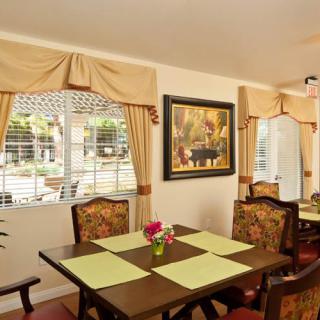 A cozy dining room with elegant furnishings and decor.