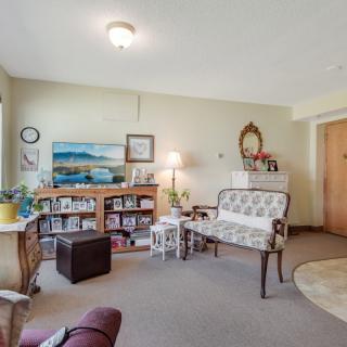 A cozy living room with vintage furniture and decor.