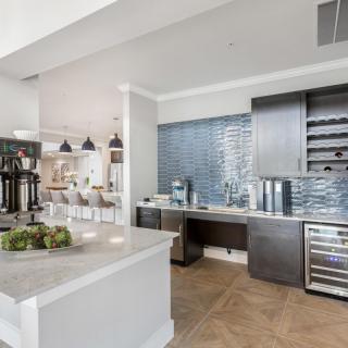 A modern kitchen with sleek appliances and a stylish backsplash.