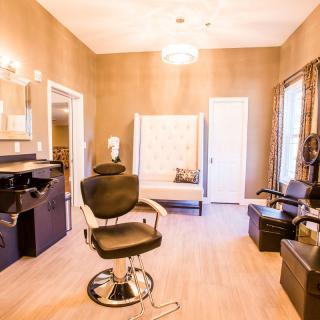 A chic and modern hair salon interior with stylish furniture.