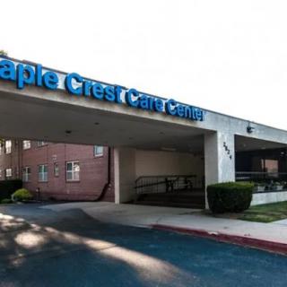 Entrance of a care center building with visible signage.