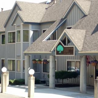 A view of a hotel's entrance with architectural details on a sunny day.
