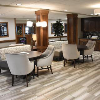 A welcoming modern lobby with comfortable seating and elegant wooden accents.