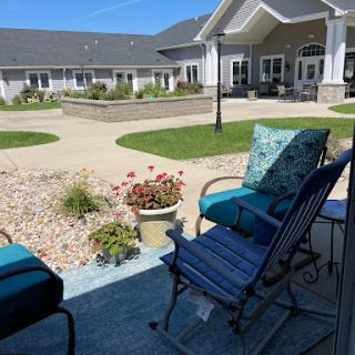 A serene outdoor seating area overlooking a landscaped courtyard.
