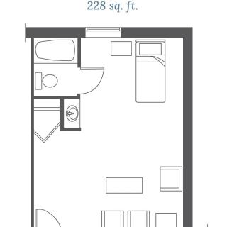 A layout of a compact 228 sq. ft. studio apartment featuring a bathroom, kitchenette, and living/sleeping area.