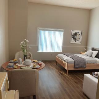 A modern, minimalist bedroom with a cozy atmosphere, featuring stylish furniture and decor.