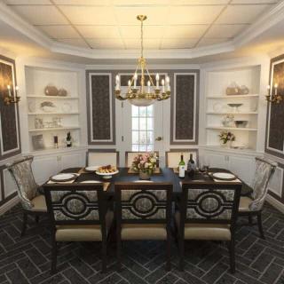 A beautifully designed dining room featuring an elegant chandelier, a well-set table, and stylish decor.