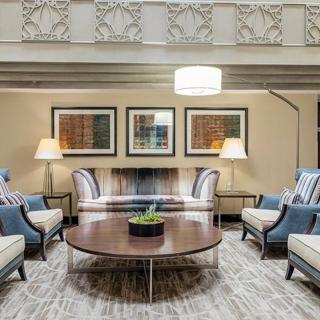 A modern living room with elegant furniture and decorative pieces.