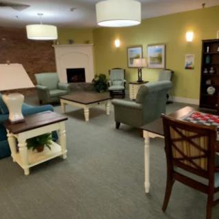 A cozy living room with comfortable seating and warm lighting.