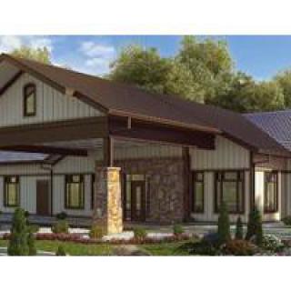 A modern single-story house with a sleek architectural design and well-maintained landscaping.
