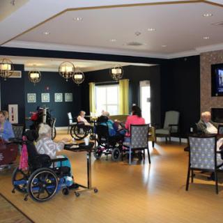 Residents enjoying a communal activity in a senior living facility.