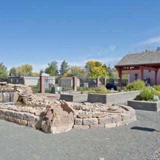 An outdoor park area featuring stone structures and garden landscapes.