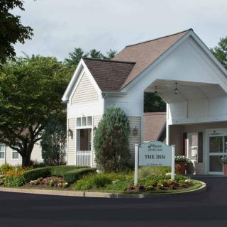 A small healthcare clinic with a welcoming entrance and well-maintained landscaping.