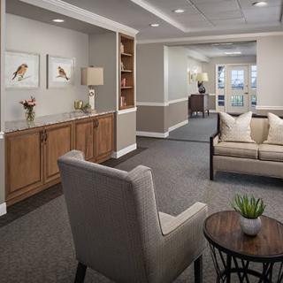A cozy and elegantly designed living room area with comfortable seating and tasteful decor.