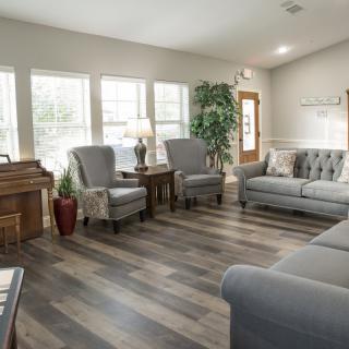 A cozy and modern living room with comfortable seating and natural light.