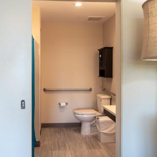 A modern restroom with a toilet and sink.